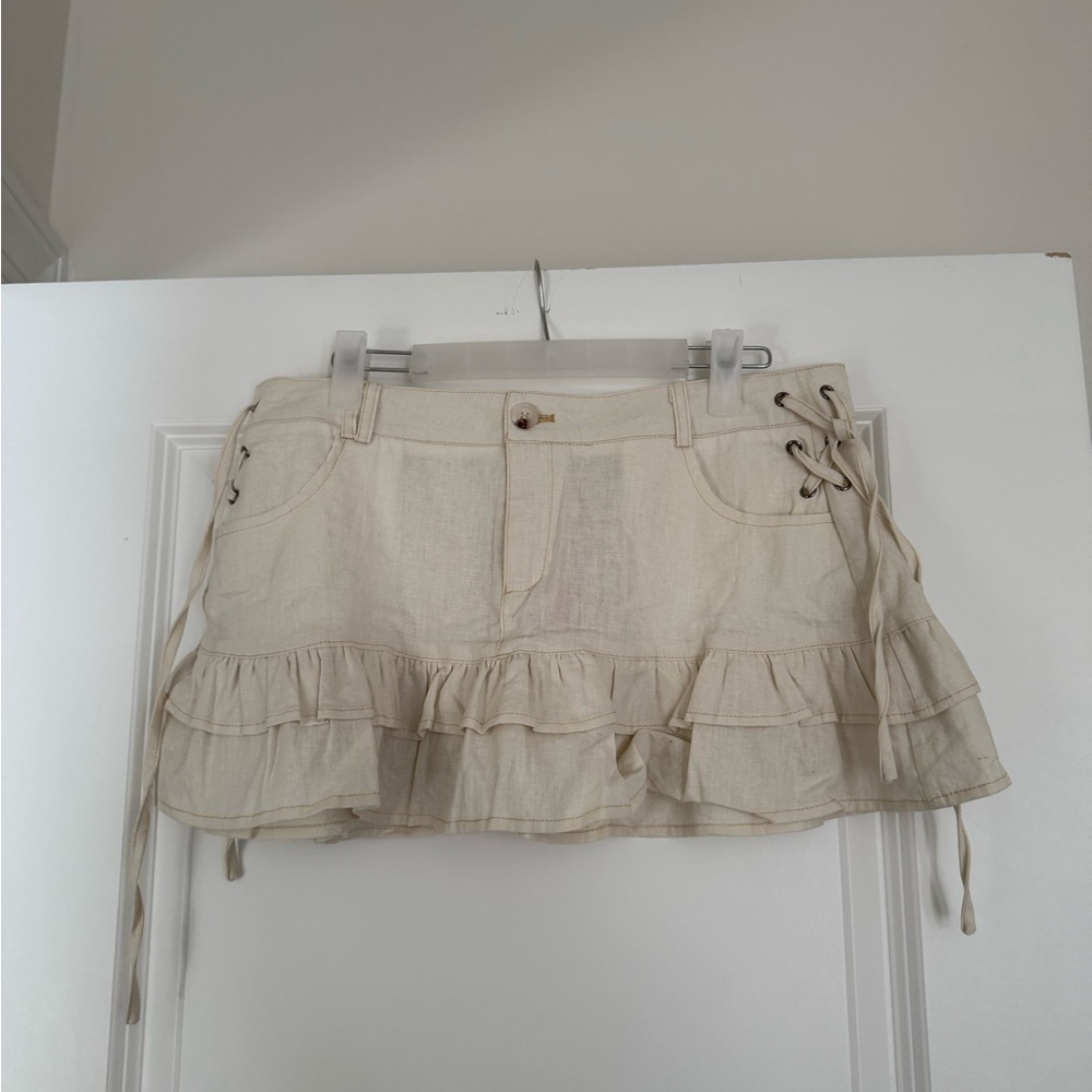 Edikted Cream Ruffled Mini Skirt with Lace-Up Sides